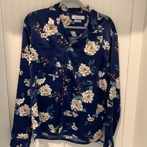 I am selling a  medium satin Urban Outfitters unisex shirt. It was never worn.